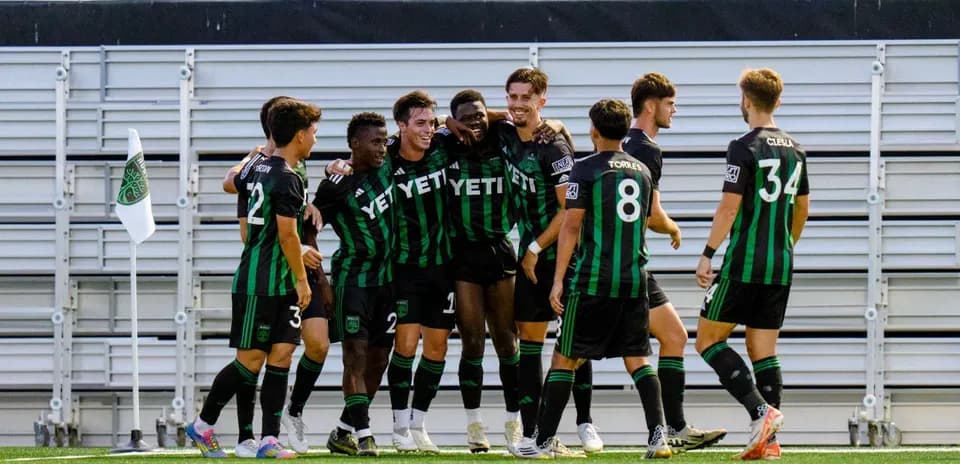 Austin II players celebrating a goal Austin II players celebrating a goal