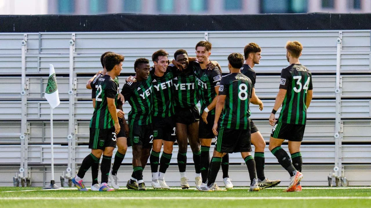 Austin II players celebrating a goal Austin II players celebrating a goal