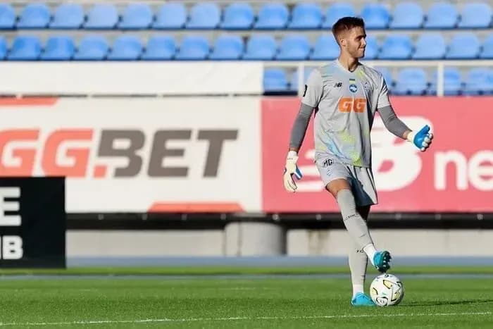 Goalkeeper warming up with a soccer ball Goalkeeper warming up with a soccer ball