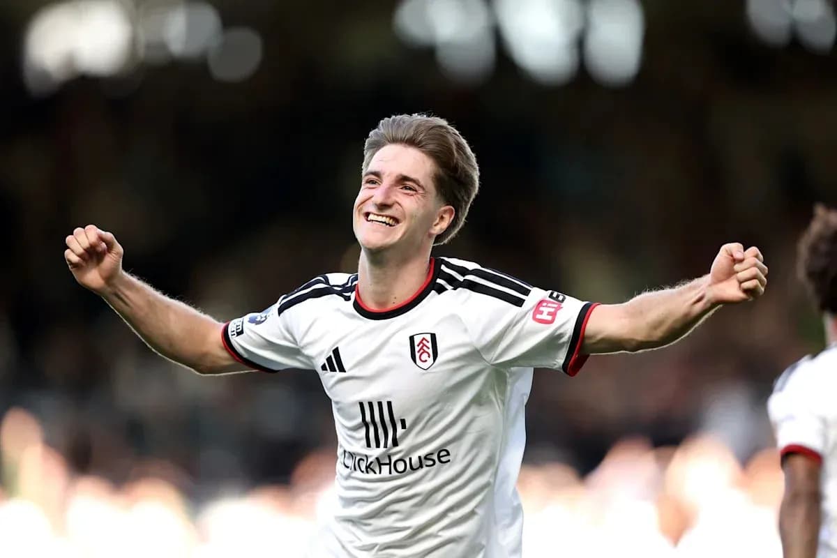Fulham player celebrating a goal on the pitch Fulham player celebrating a goal on the pitch