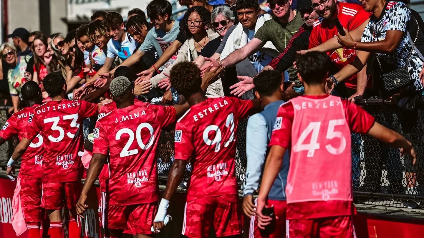Players interacting with fans after the match Players interacting with fans after the match