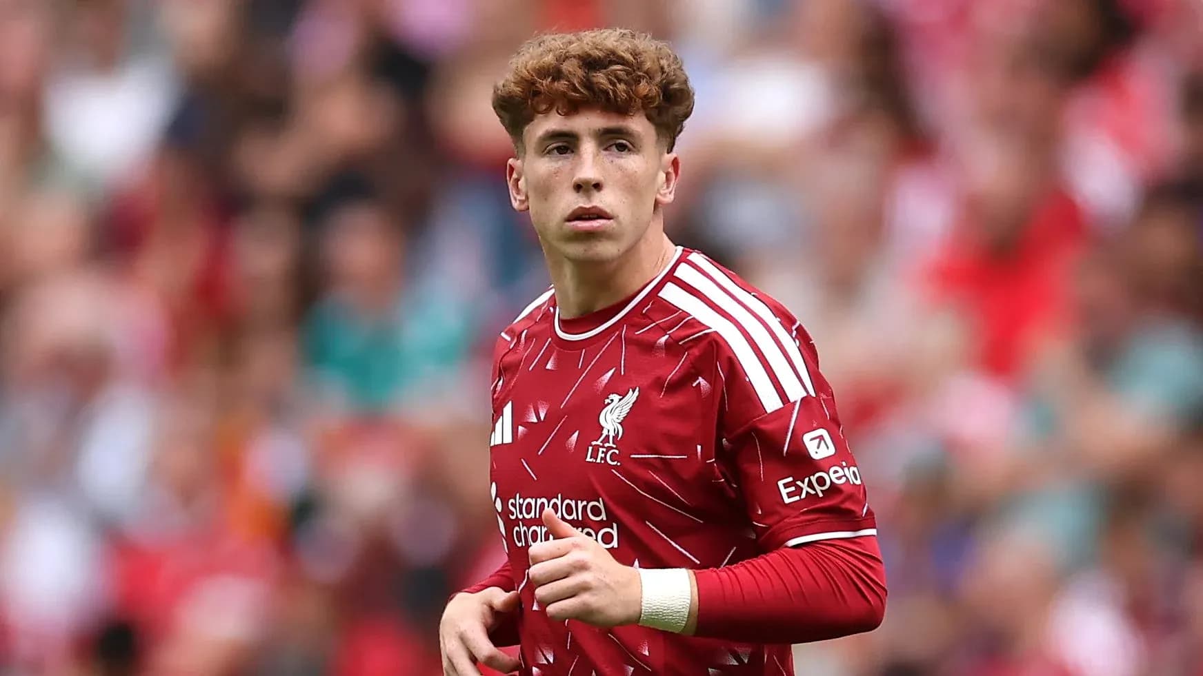 Player wearing Liverpool kit on the pitch Player wearing Liverpool kit on the pitch