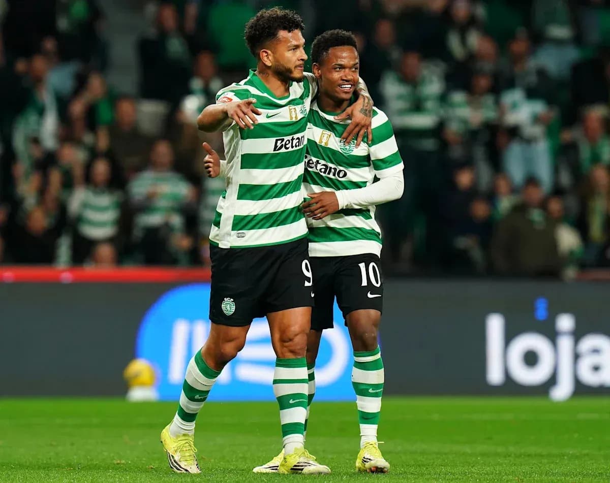 Two players celebrating on the field in jerseys Two players celebrating on the field in jerseys