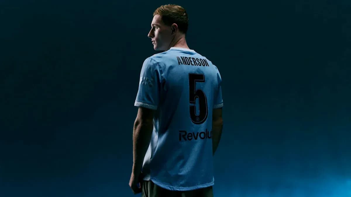 Player wearing blue jersey with number 5 Player wearing blue jersey with number 5