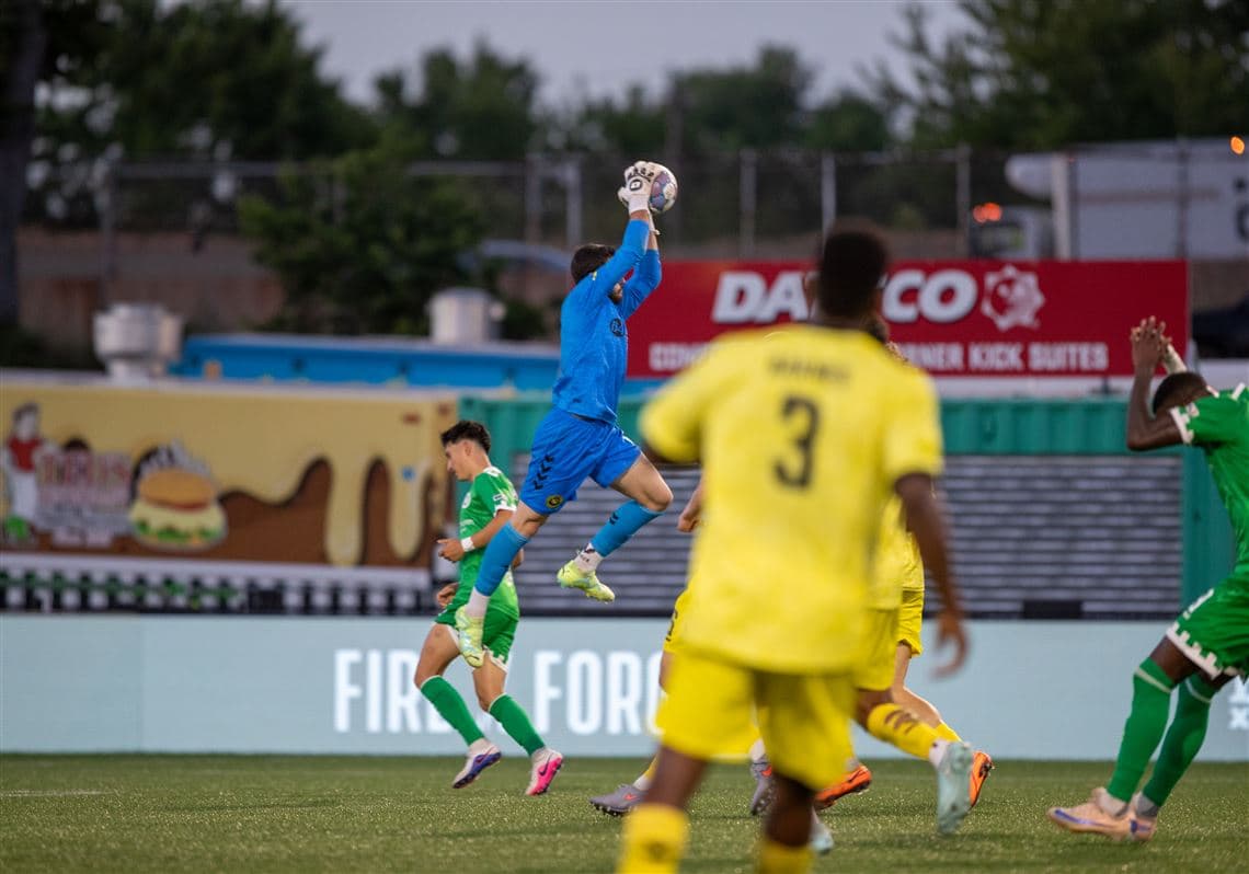 Goalkeeper catching ball during Hartford Athletic match Goalkeeper catching ball during Hartford Athletic match