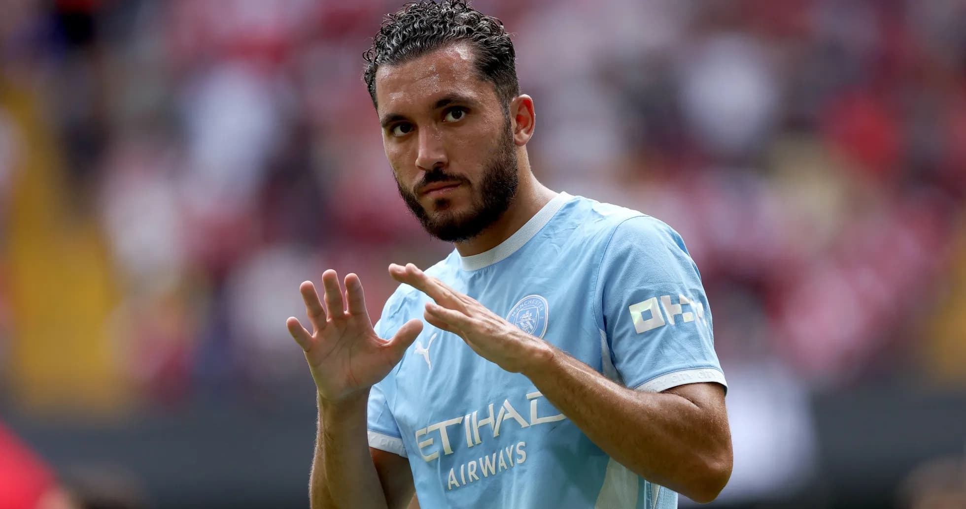 Player gesturing during warm-up on the field Player gesturing during warm-up on the field