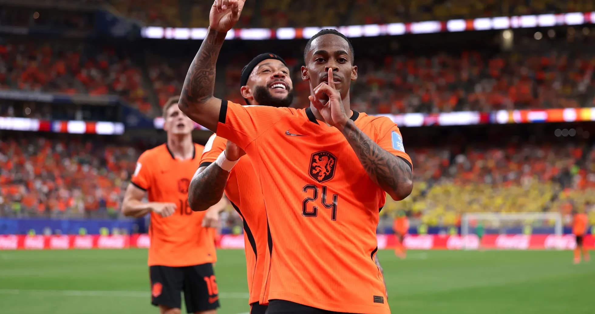 Players celebrating a goal during a match Players celebrating a goal during a match
