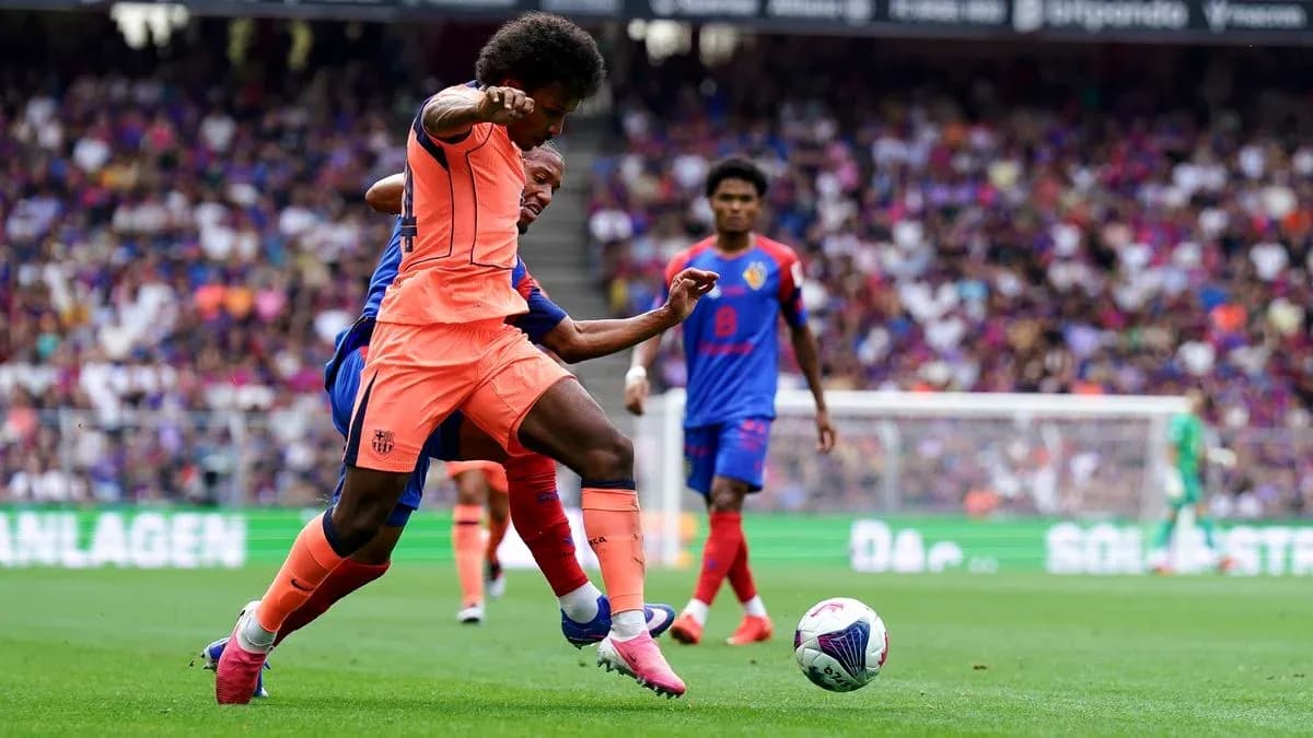 Player challenging for the ball during football match Player challenging for the ball during football match