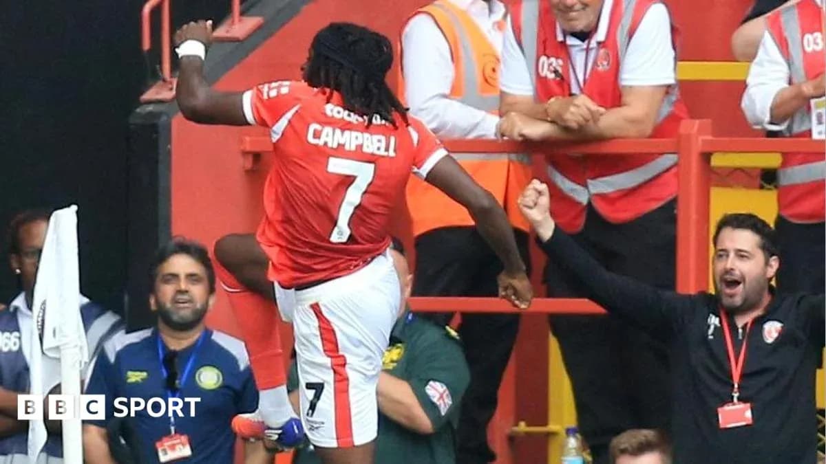 Player celebrating with fans after scoring a goal Player celebrating with fans after scoring a goal