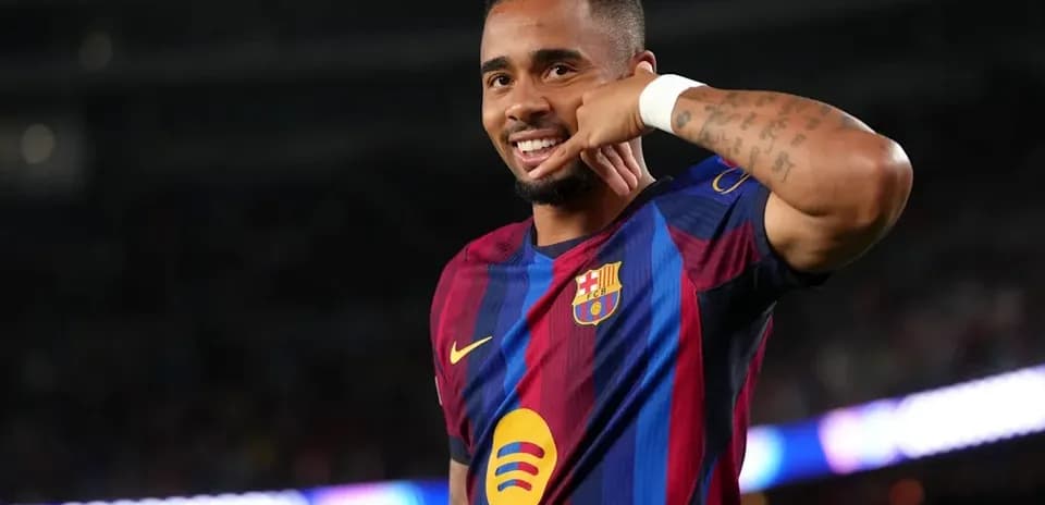 Player celebrating with a phone gesture after scoring Player celebrating with a phone gesture after scoring