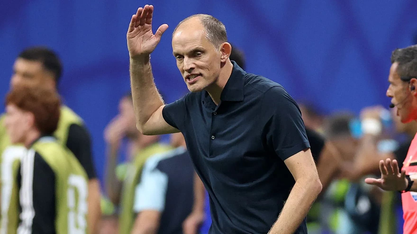 Coach gesturing during a match on the sidelines Coach gesturing during a match on the sidelines