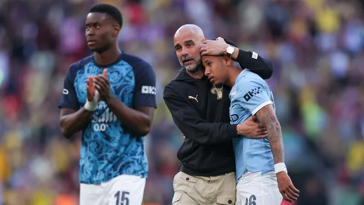 Coach comforting player after match on field Coach comforting player after match on field