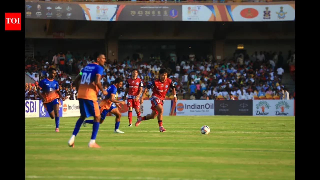 Players competing for the ball during football match Players competing for the ball during football match