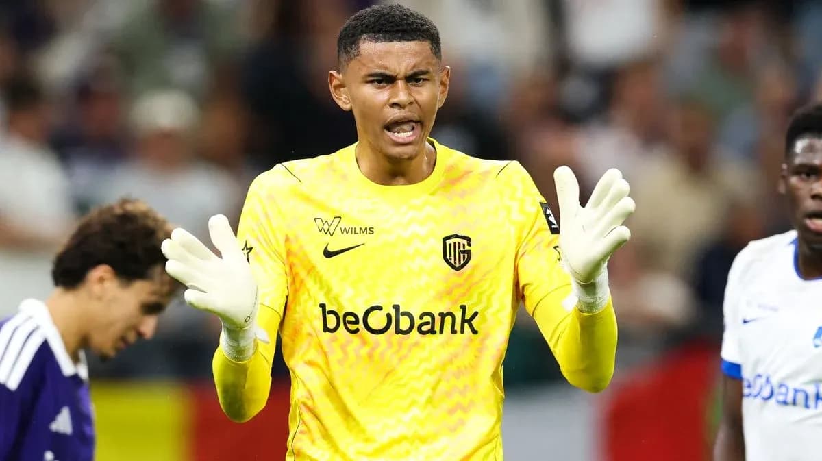 Goalkeeper in yellow kit directing teammates during match Goalkeeper in yellow kit directing teammates during match
