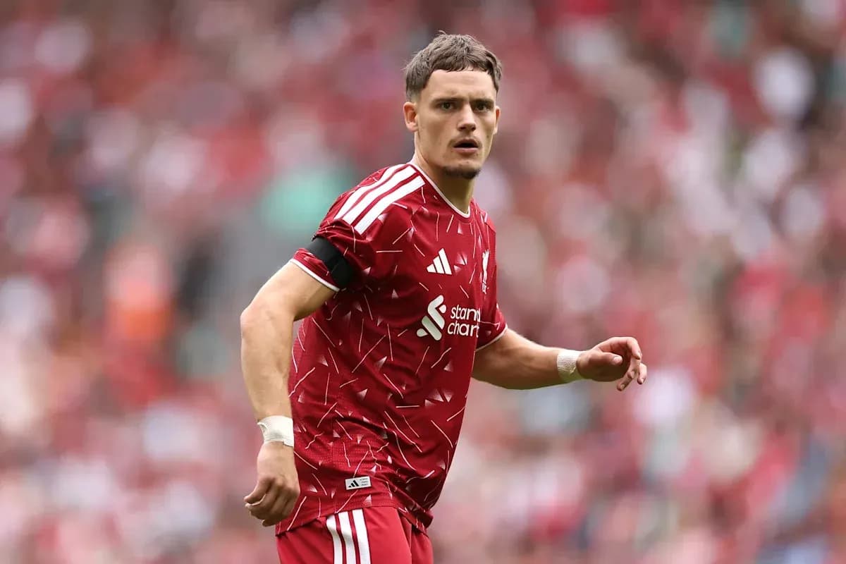 Player in red jersey during a football match Player in red jersey during a football match