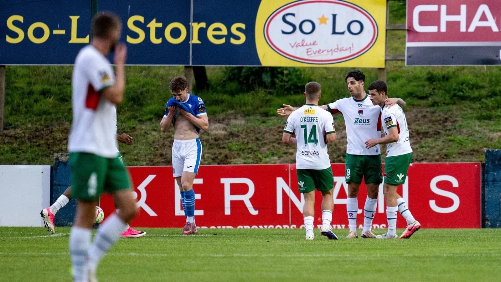 Players celebrating a goal during a football match Players celebrating a goal during a football match