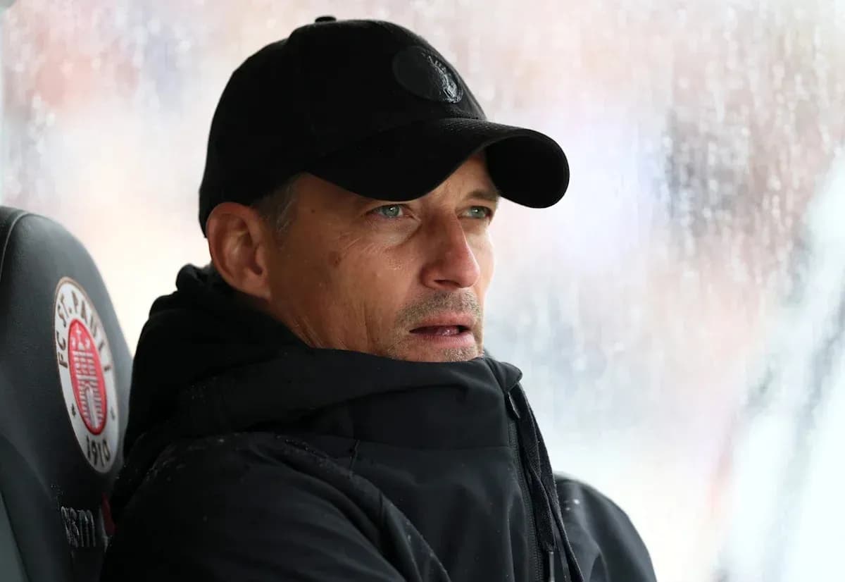Coach observing the match from the sidelines Coach observing the match from the sidelines
