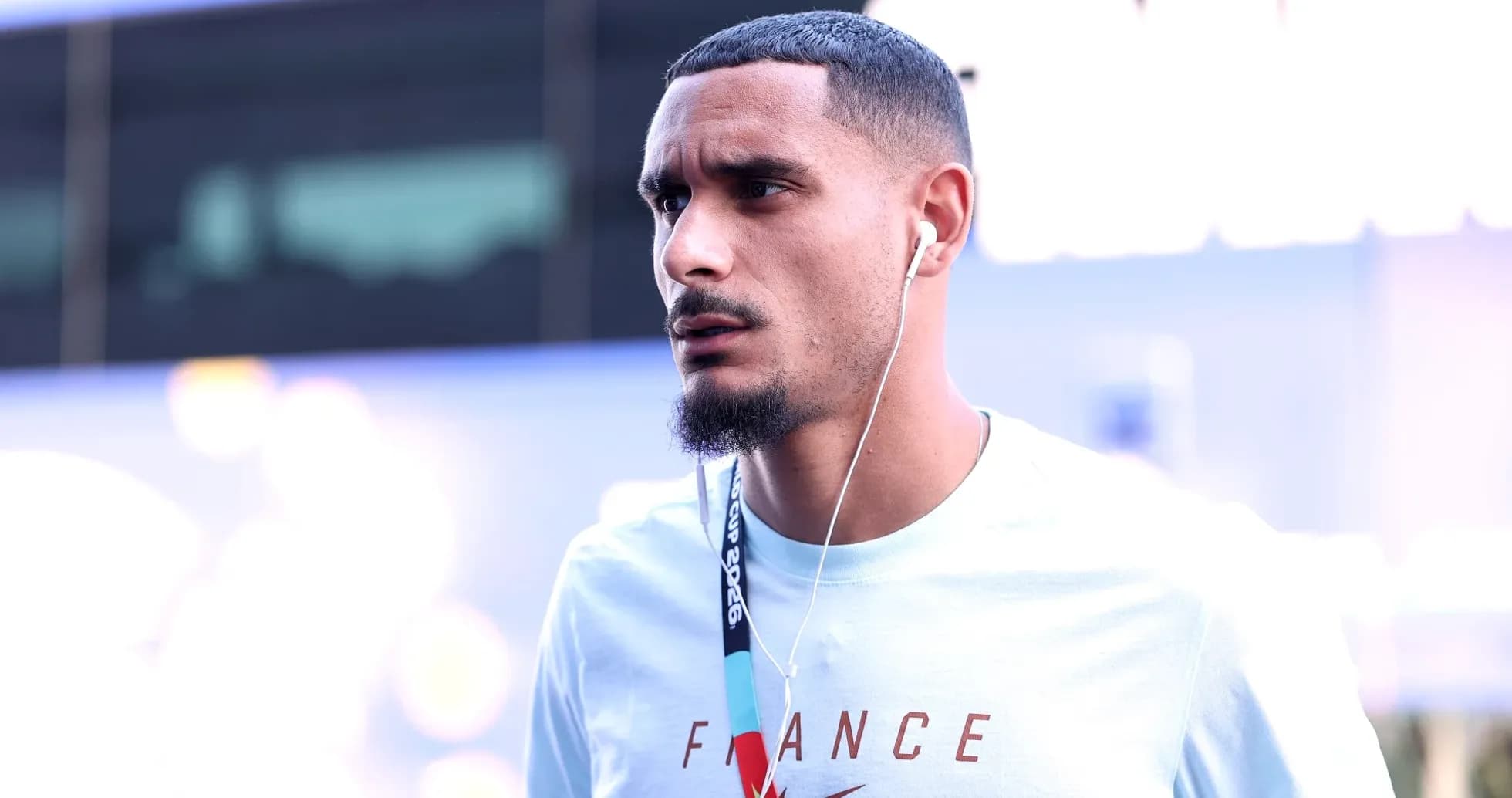 Player walking with headphones before match Player walking with headphones before match