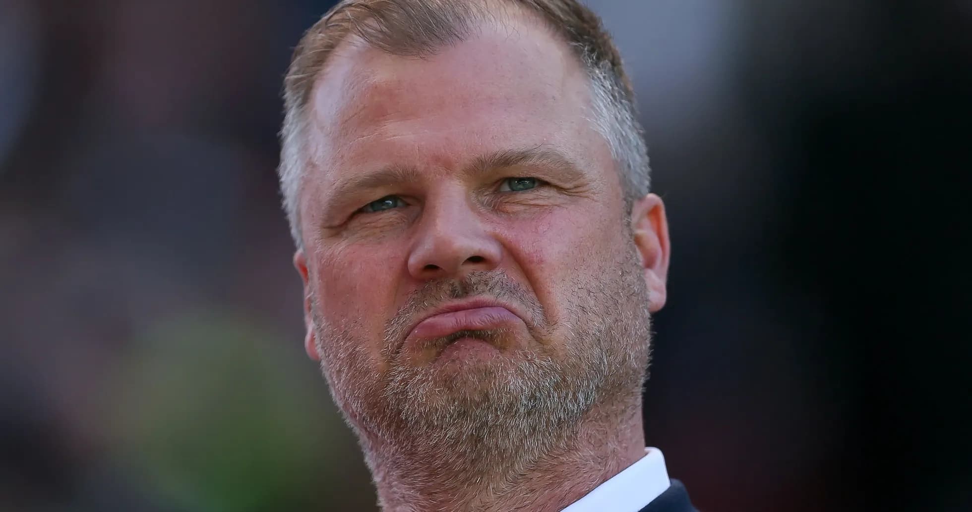 Man with a serious expression during a match Man with a serious expression during a match