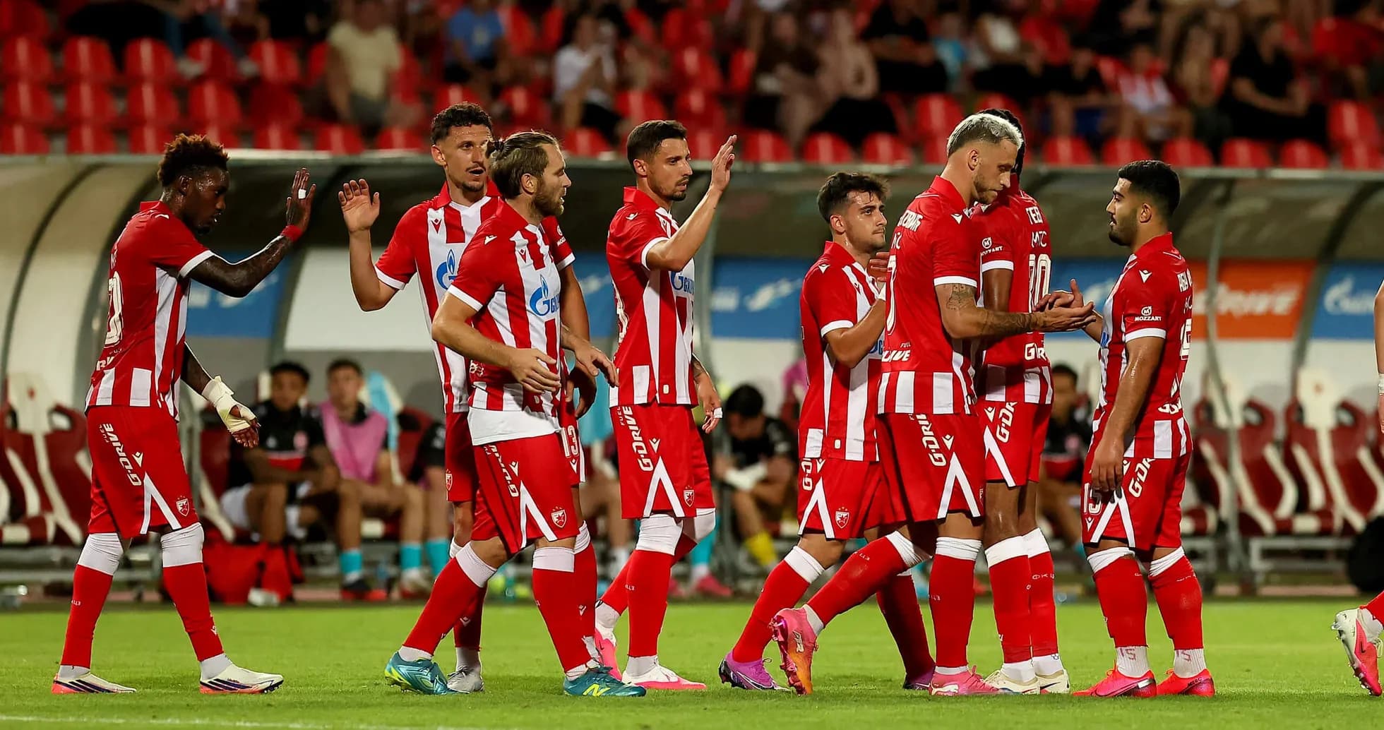 Players celebrating after a goal during match Players celebrating after a goal during match