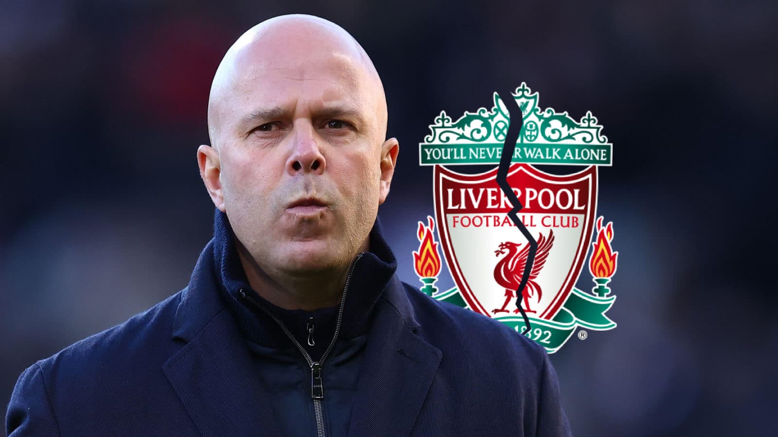 Coach standing in front of Liverpool FC logo Coach standing in front of Liverpool FC logo