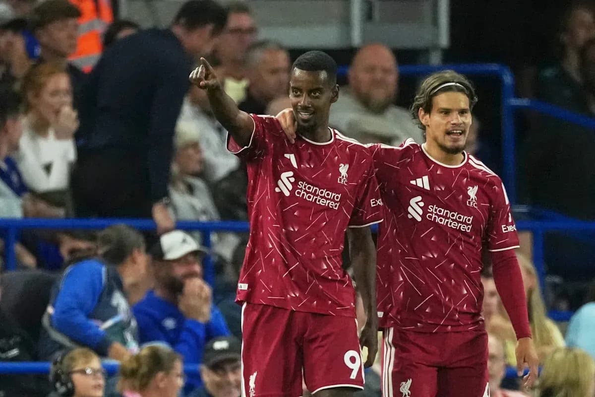 Liverpool players celebrating a goal on the pitch Liverpool players celebrating a goal on the pitch