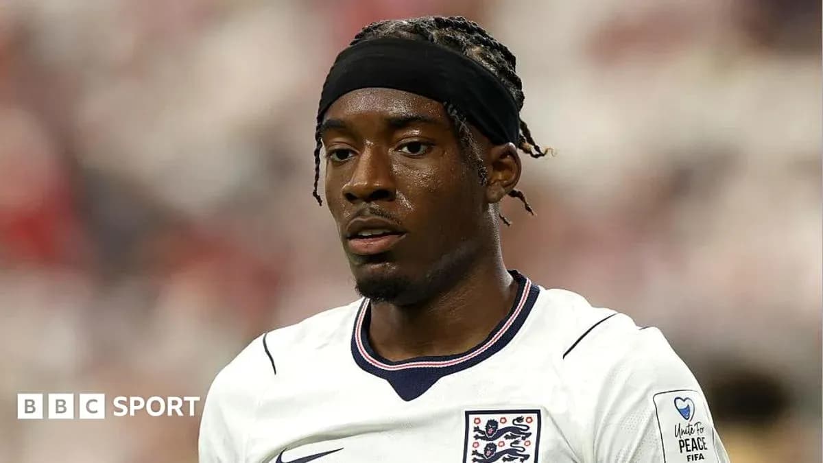 Football player wearing England jersey during match Football player wearing England jersey during match