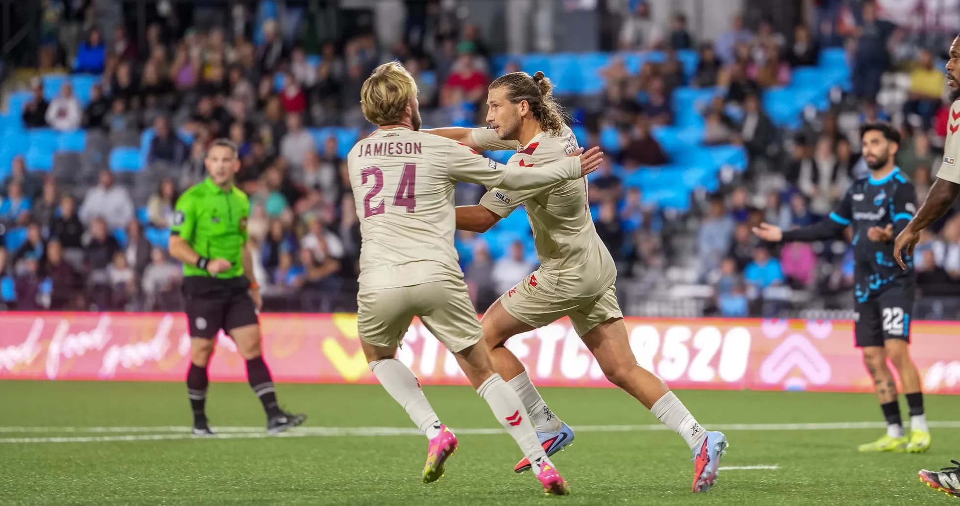 Players celebrating a goal during match Players celebrating a goal during match