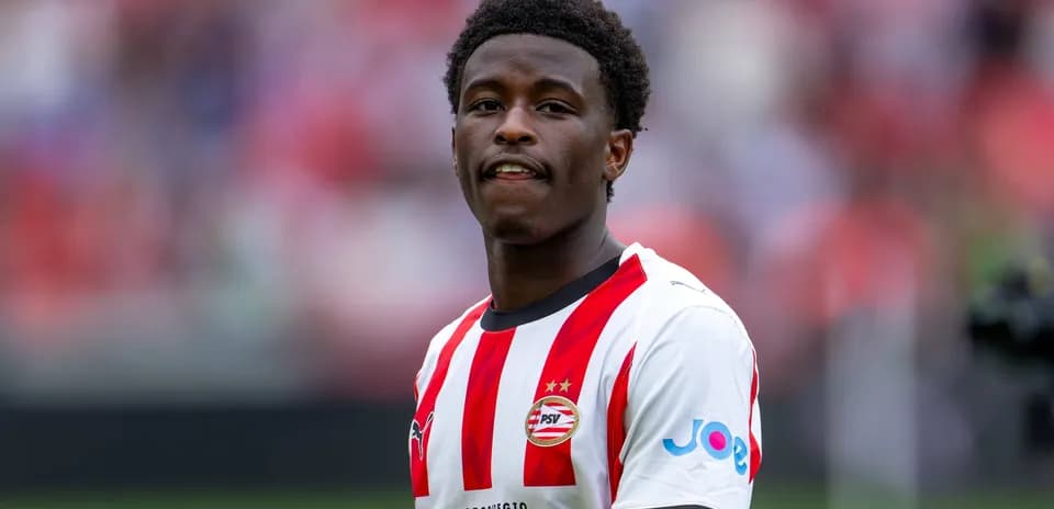 Player in PSV Eindhoven jersey on the field Player in PSV Eindhoven jersey on the field