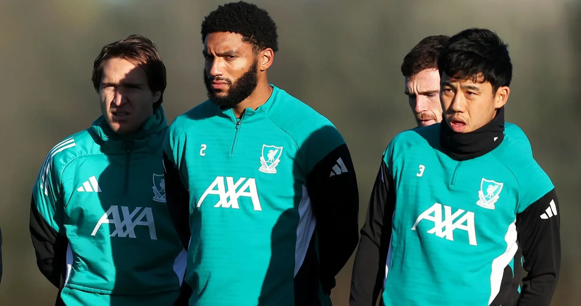 Four players in Liverpool training gear during session Four players in Liverpool training gear during session