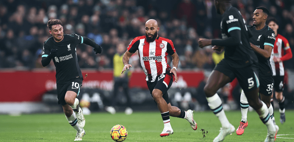 Liverpool player chasing the ball against Brentford Liverpool player chasing the ball against Brentford