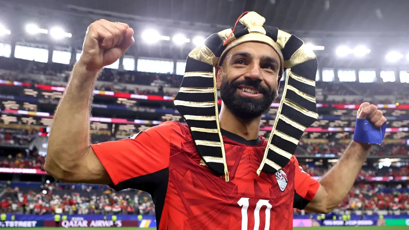 Player celebrating in Egyptian-themed headpiece after match Player celebrating in Egyptian-themed headpiece after match