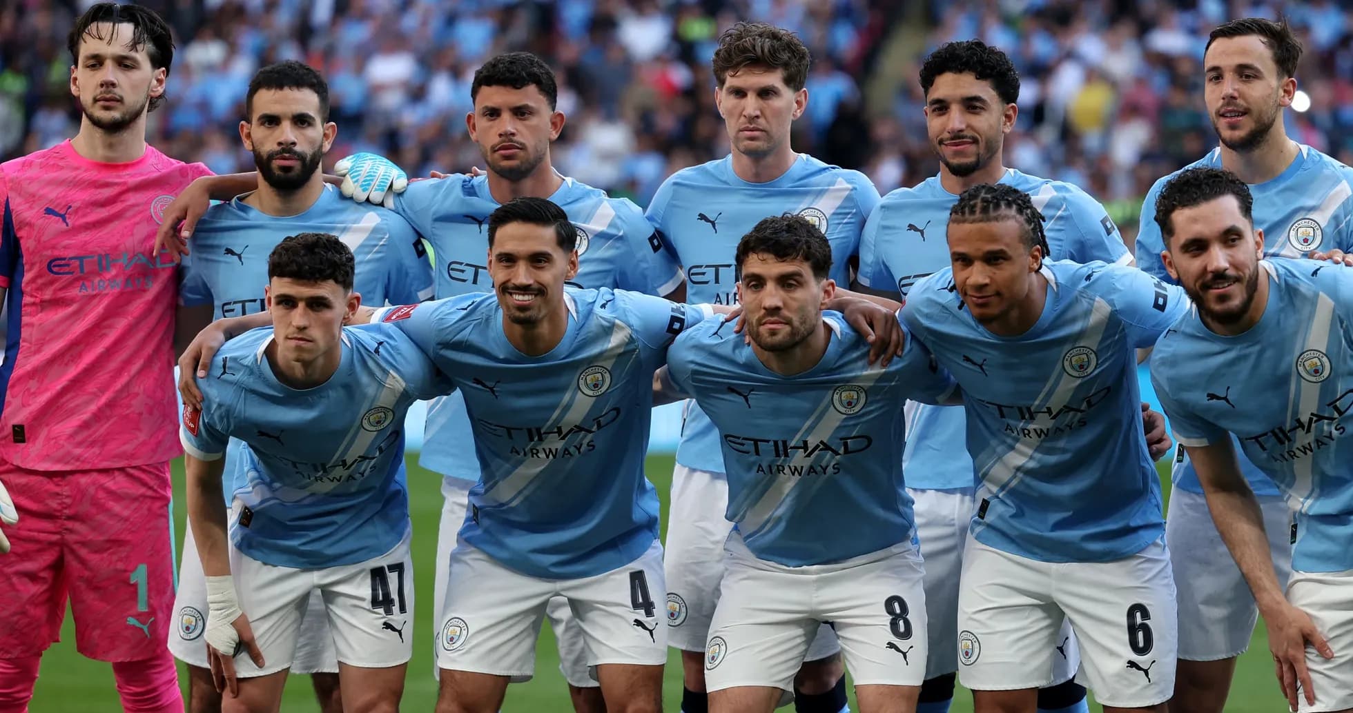 Manchester City players posing for team photo Manchester City players posing for team photo