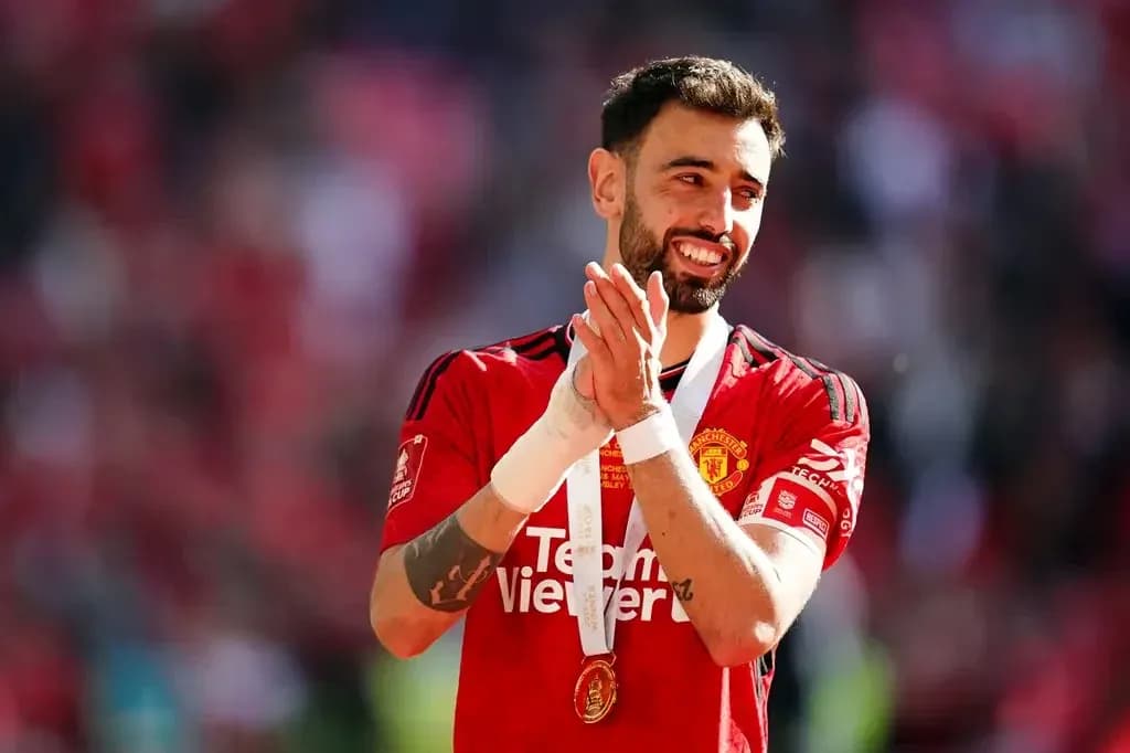Bruno Fernandes celebrating with medal after match Bruno Fernandes celebrating with medal after match