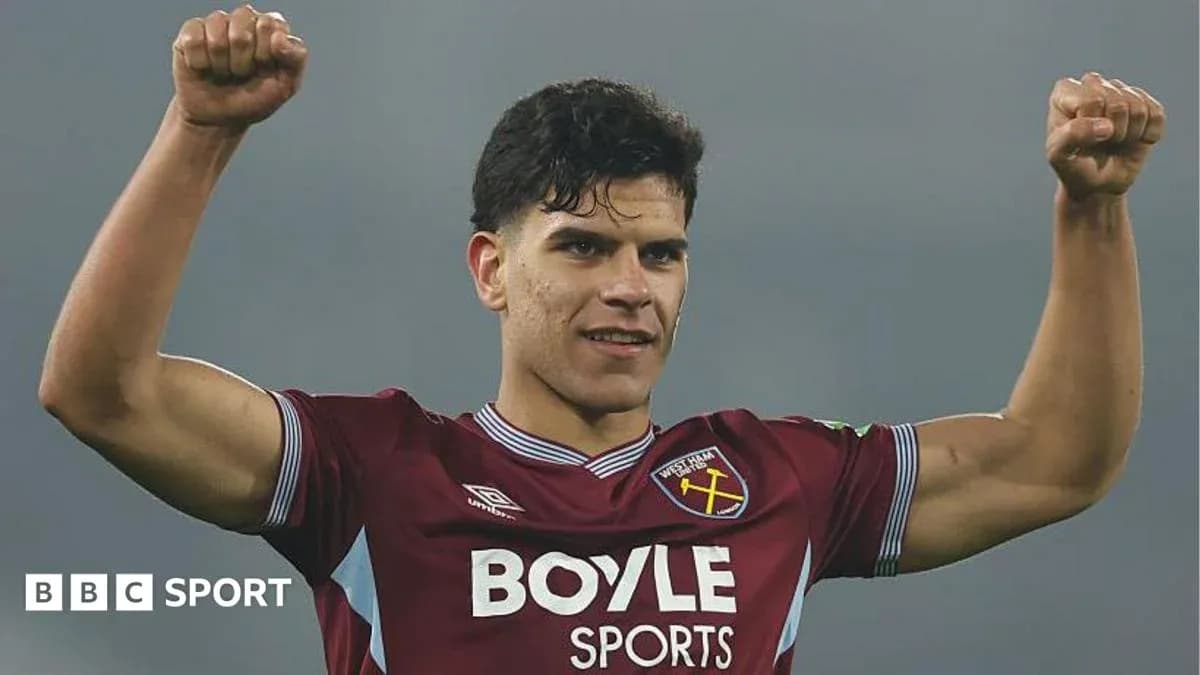 Player celebrating victory in West Ham kit Player celebrating victory in West Ham kit