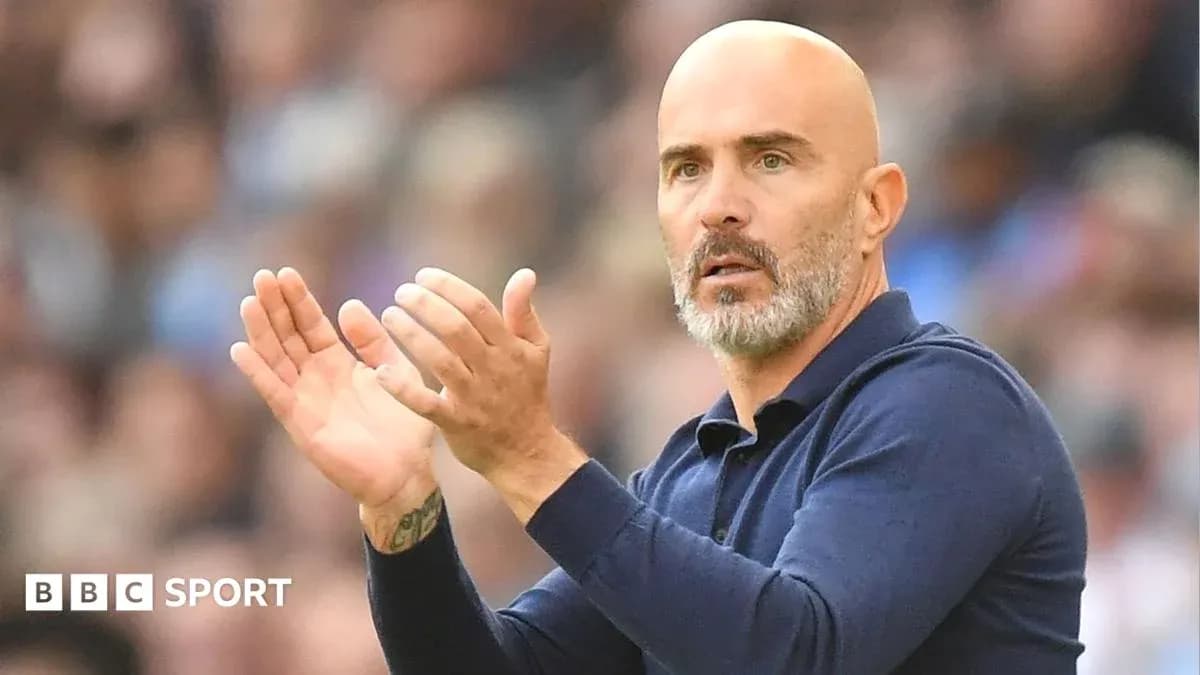 Manager clapping during a football match Manager clapping during a football match