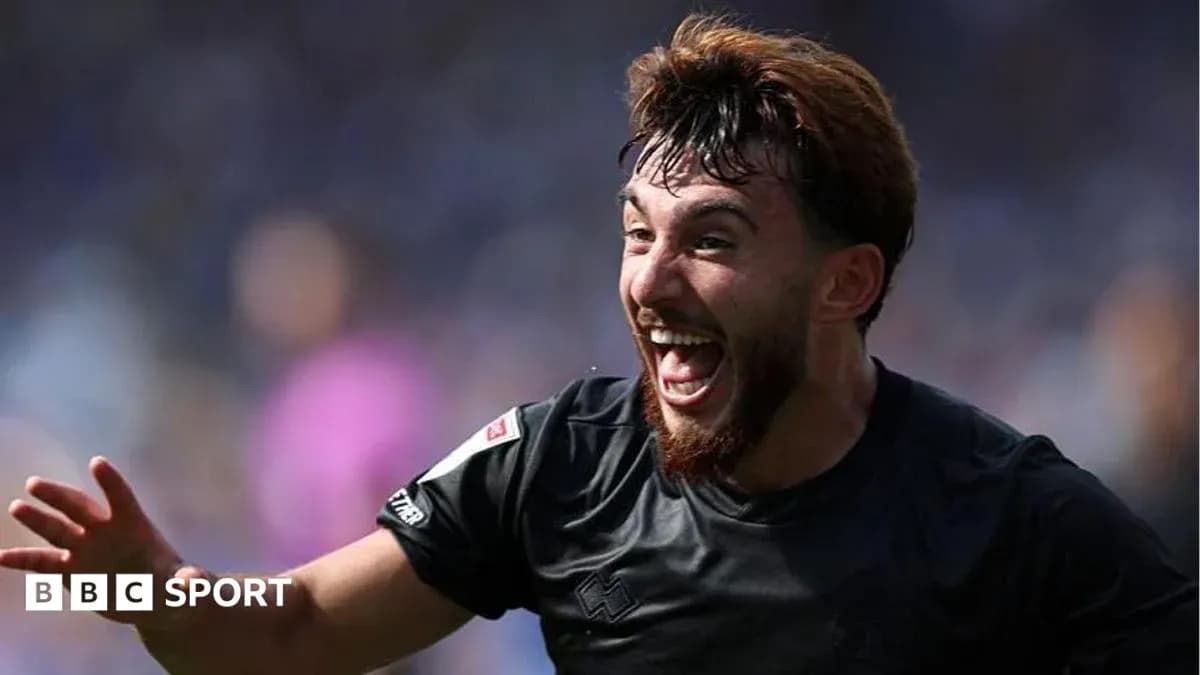 Player celebrating a goal during a match Player celebrating a goal during a match