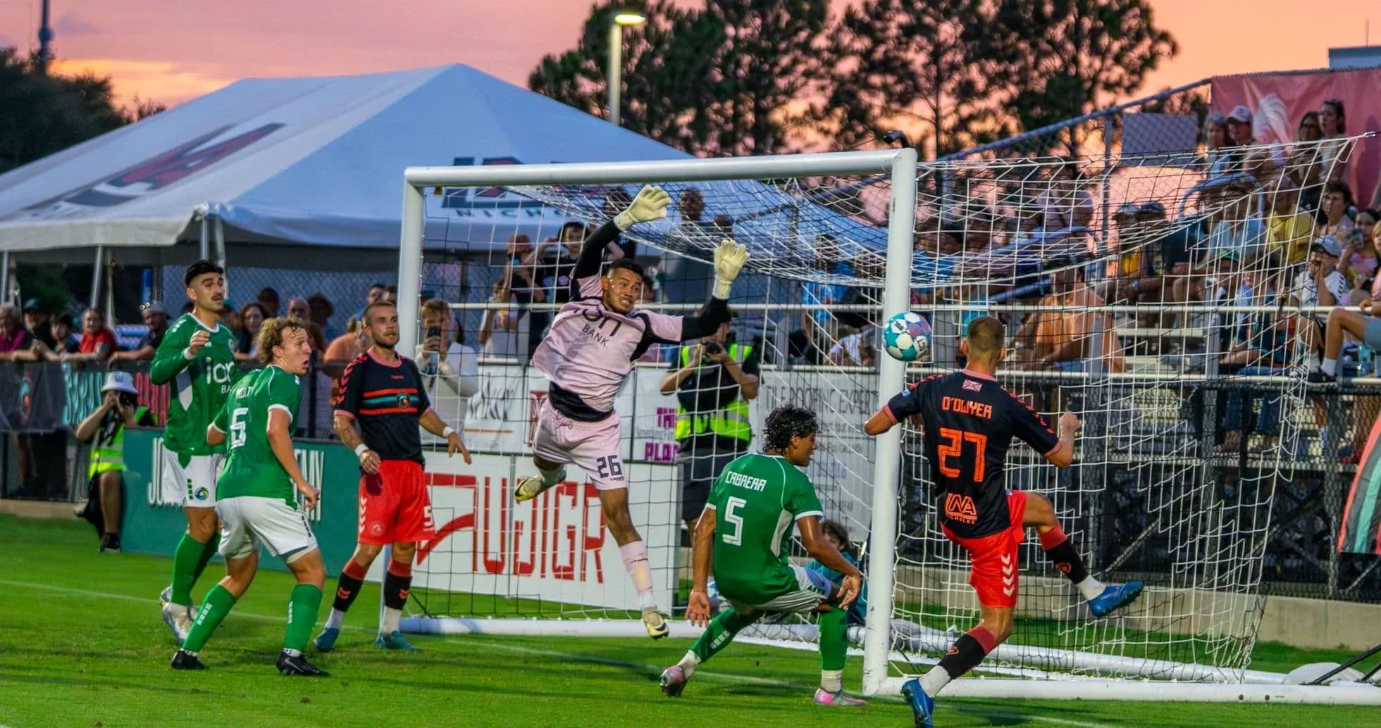 Goalkeeper jumping to save during match Goalkeeper jumping to save during match