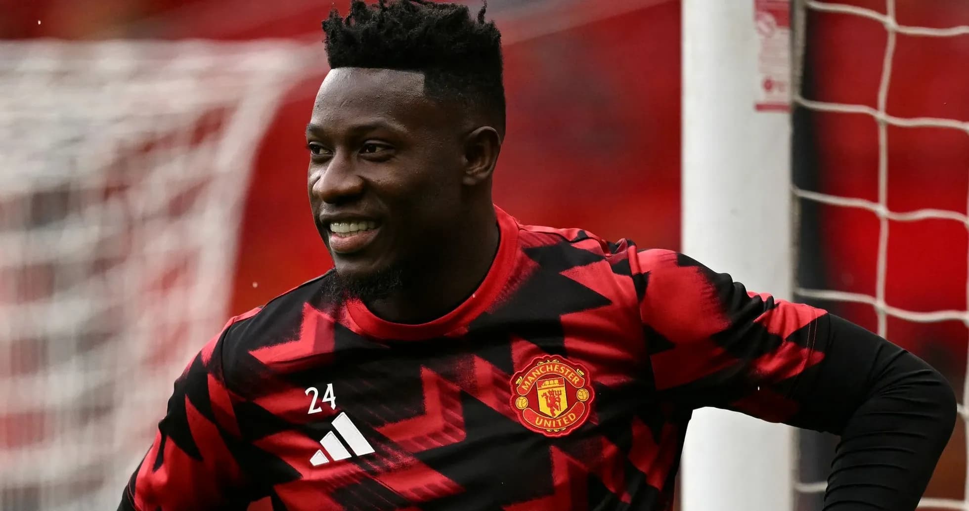 Goalkeeper in Manchester United kit smiling during warm-up Goalkeeper in Manchester United kit smiling during warm-up