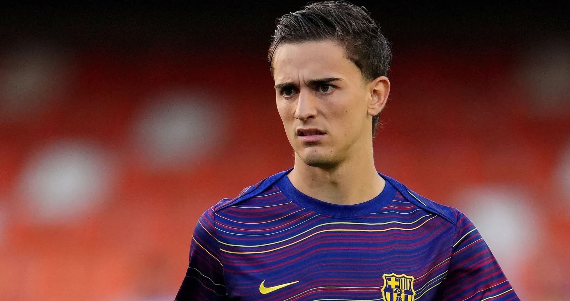 Player in FC Barcelona jersey on the field Player in FC Barcelona jersey on the field