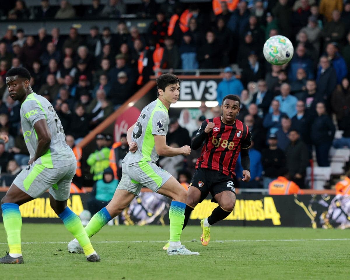 Bournemouth player controlling ball against Manchester City Bournemouth player controlling ball against Manchester City