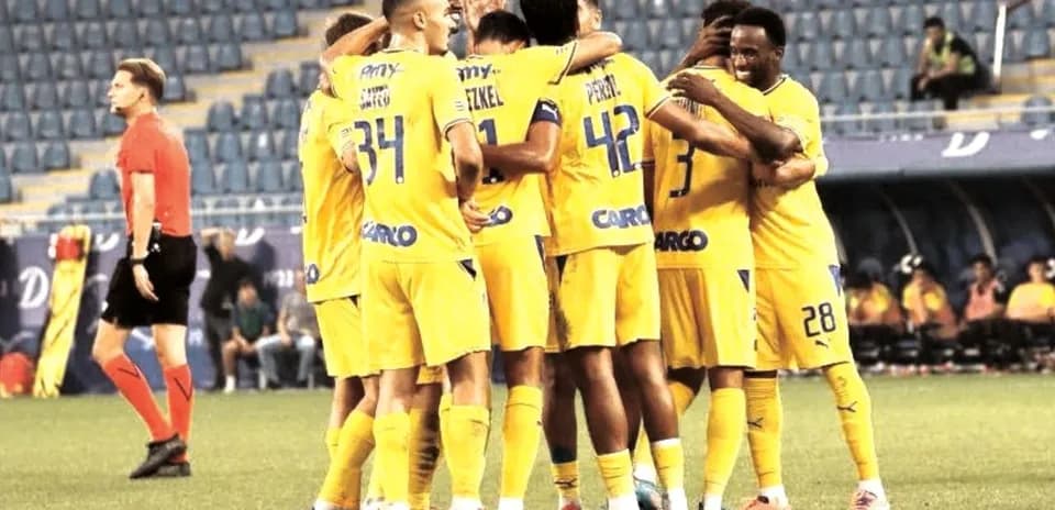 Maccabi Tel Aviv players celebrating a goal Maccabi Tel Aviv players celebrating a goal