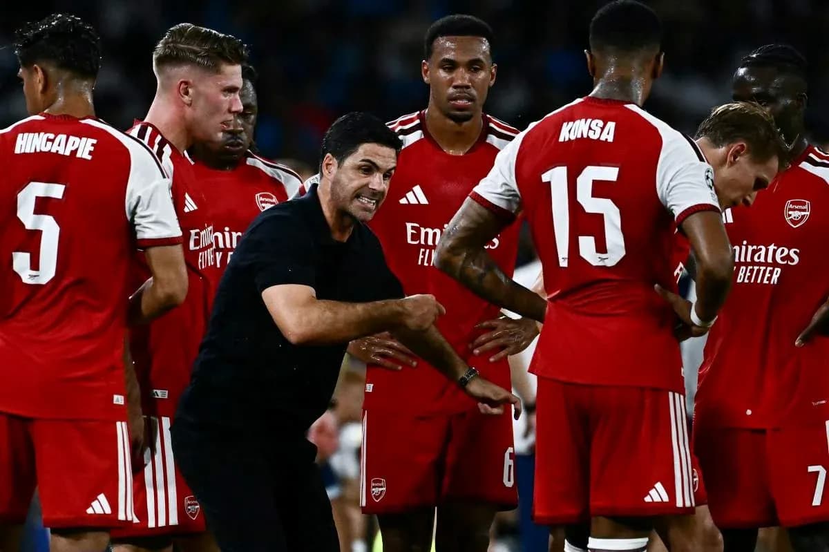 Arsenal manager instructing players during team huddle Arsenal manager instructing players during team huddle