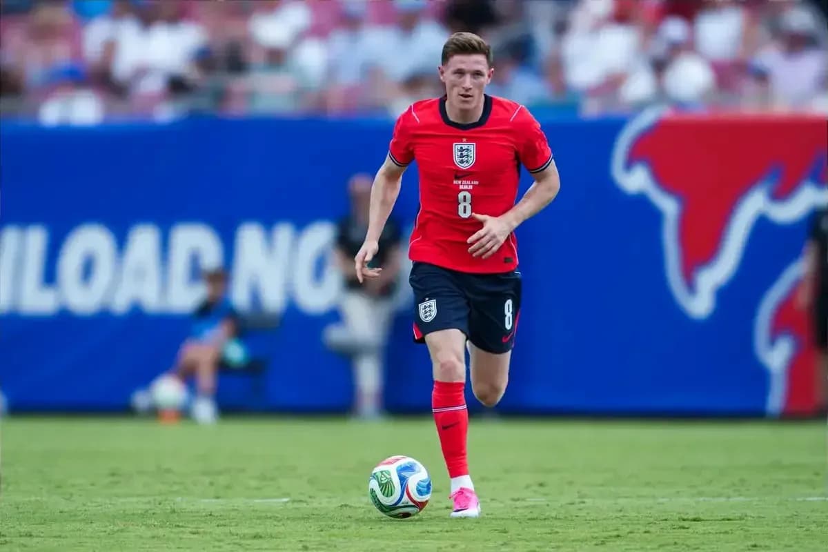 Player in red jersey running with soccer ball Player in red jersey running with soccer ball