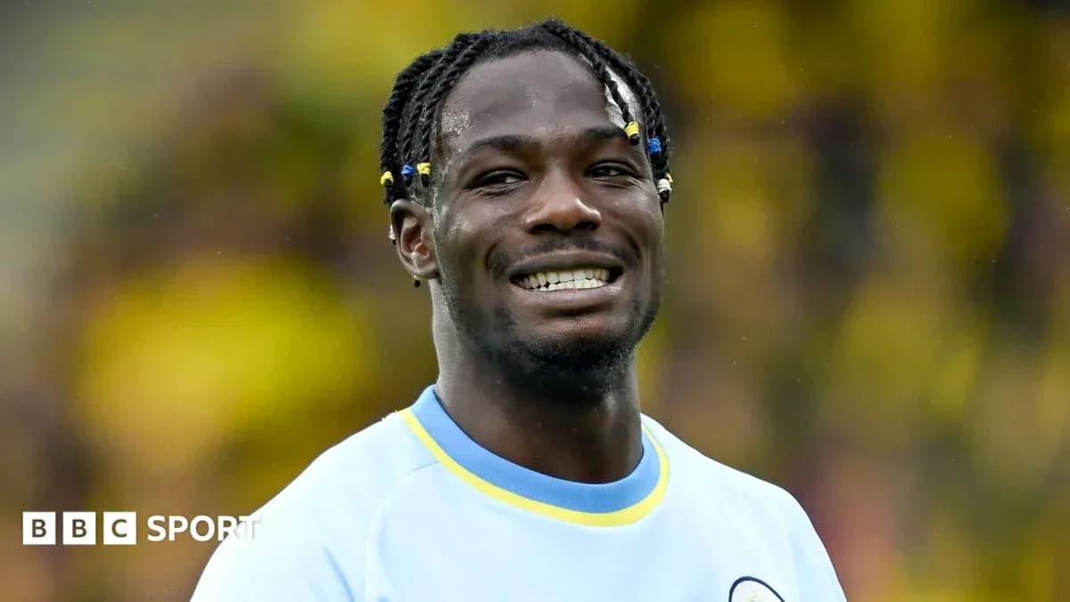 Player smiling in team uniform during match Player smiling in team uniform during match