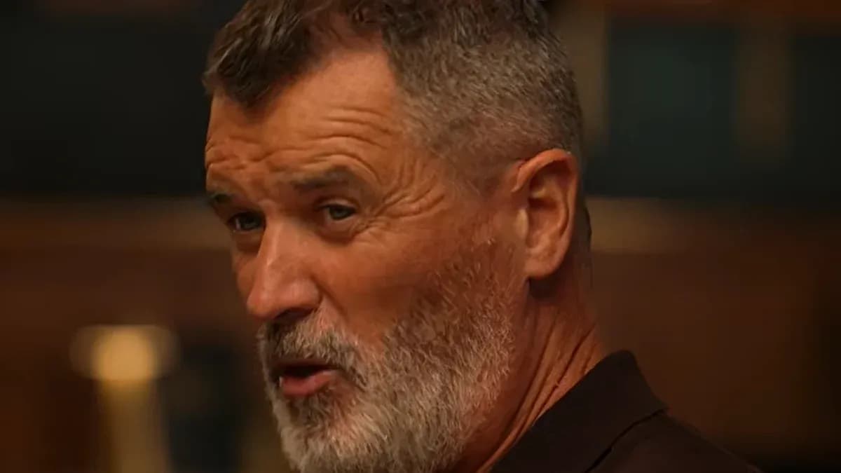 Man with gray beard speaking in a room Man with gray beard speaking in a room