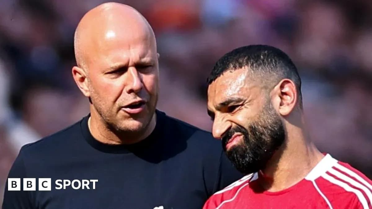 Two individuals discussing on the field after match Two individuals discussing on the field after match