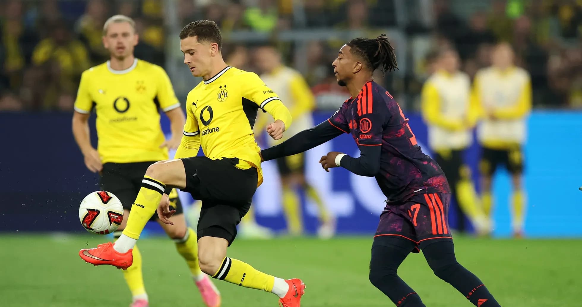 Player dribbling the ball during match action Player dribbling the ball during match action