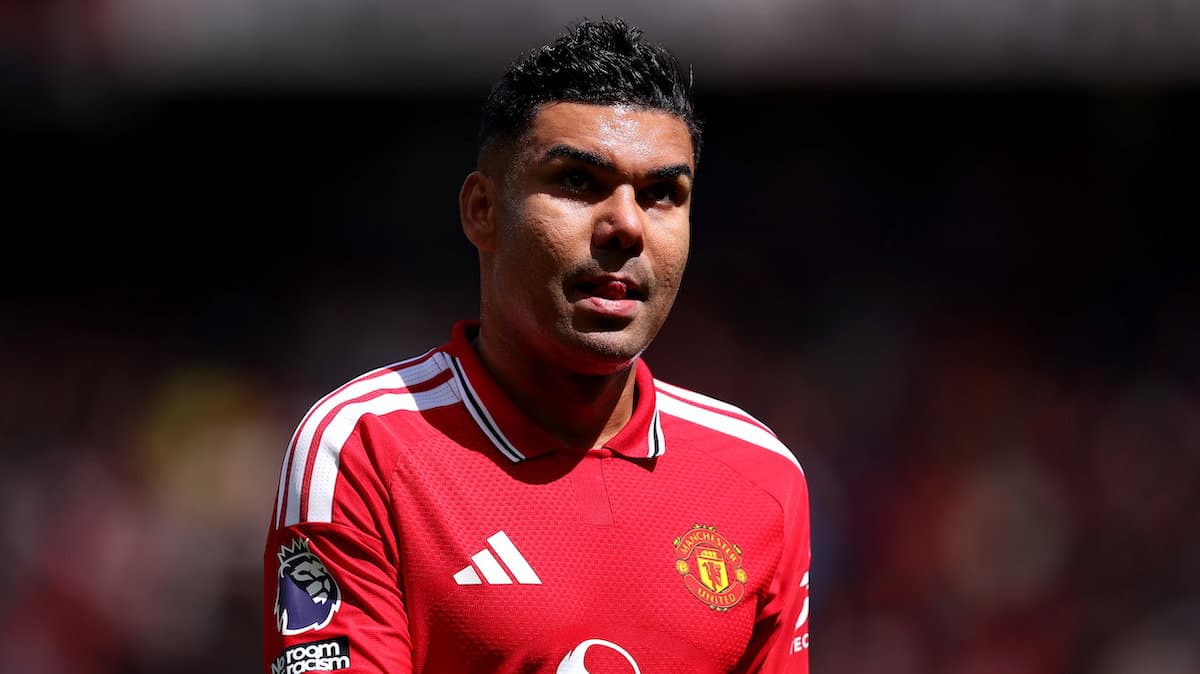 Player wearing Manchester United kit on field Player wearing Manchester United kit on field