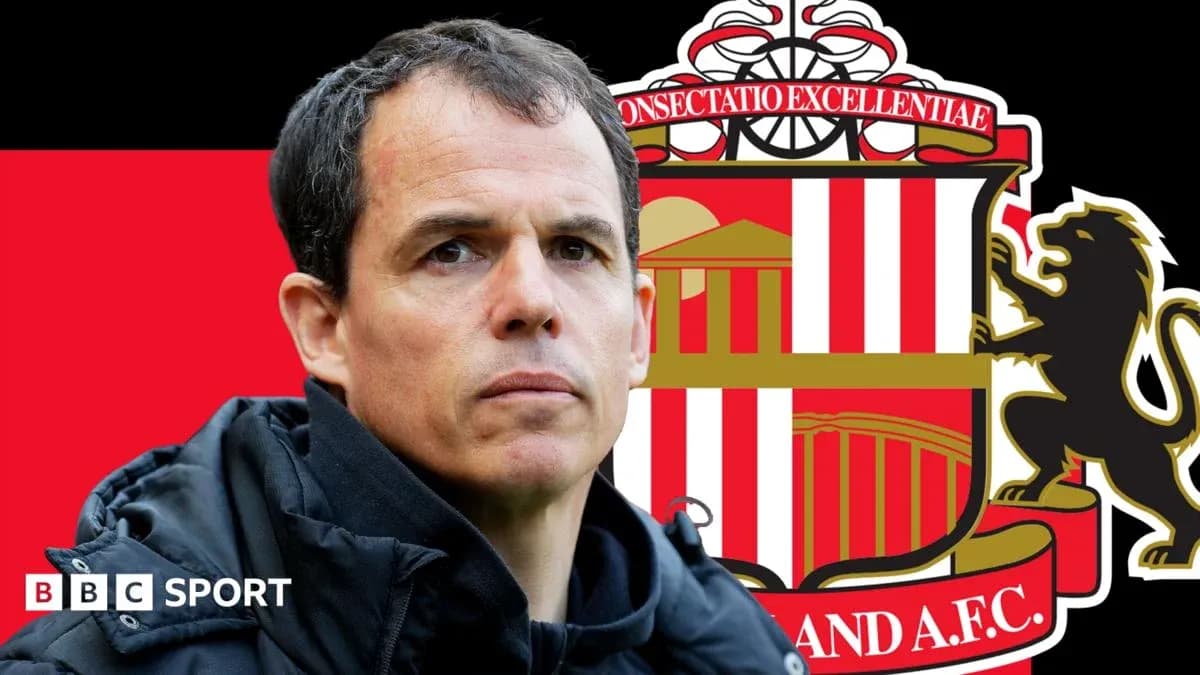 Coach in front of Sunderland AFC club logo Coach in front of Sunderland AFC club logo